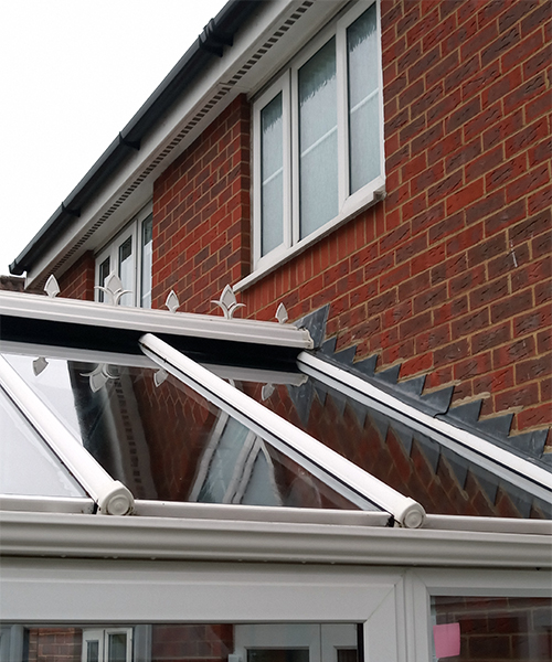 Showing a very clean conservatory glass roof